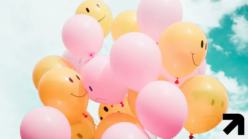 Balões com carinhas tristes e felizes mostrando fases possíveis da depressão sob tratamento